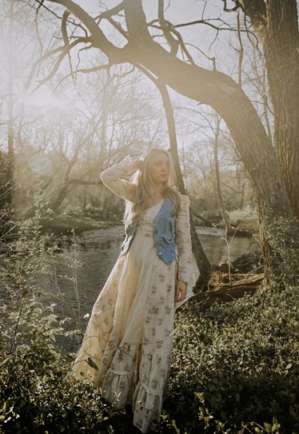 Summerlyn Powers stands on a riverbank in this promo photo